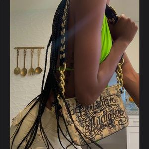 Anybody selling this Christian audigier bag? Hmu